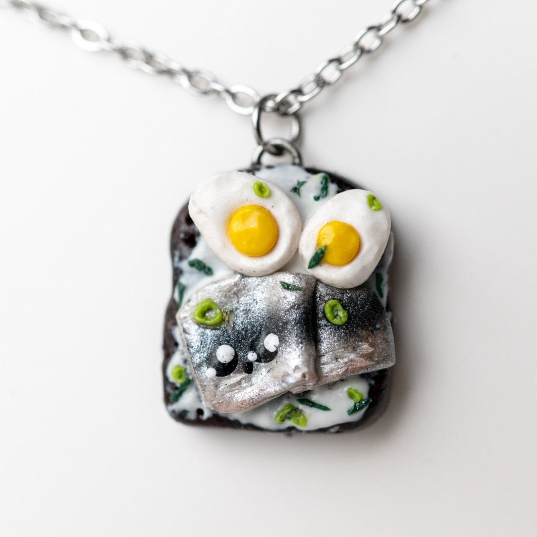 Rye bread with herring and egg